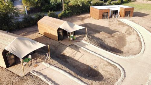 an overhead view of a building with a tent at La cabane in Beaurepaire