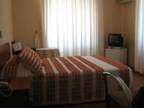 Postel nebo postele na pokoji v ubytování Alize Hotel