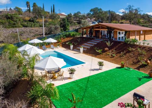 an aerial view of a house with a swimming pool at Design Chalet in Albufeira With Private Pool in Albufeira