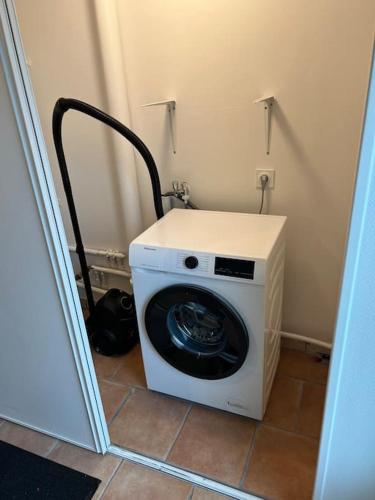a washer and dryer in a corner of a room at Charmante maison en Brenne in Vendoeuvres