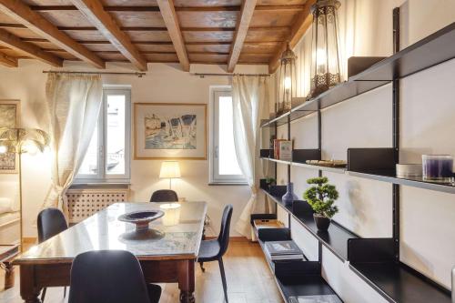 a dining room with a table and chairs at Milan Royal Suites - Centro in Milan