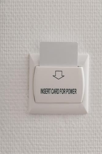 a white box with an insert card for power at suite 18 luxury apartments in Bari