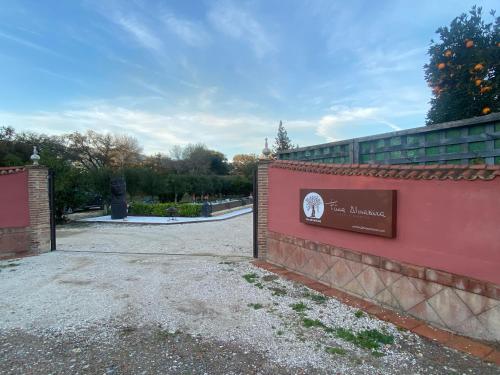 a gate to a park with a sign on it at FINCA ALMAZARA in San Pablo