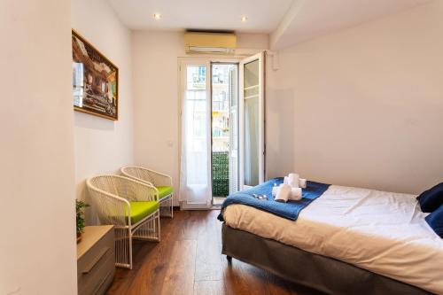 a small bedroom with a bed and a window at BAMBOO PLAGE AP4220 by Riviera Holiday Homes in Nice