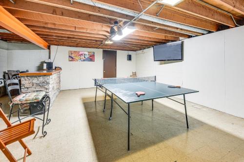 a ping pong table in the middle of a room at Convenient Racine Home 4 Mi to Lake Michigan! in Racine