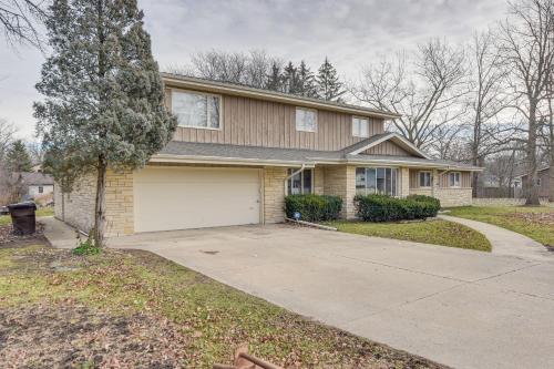 a house with a driveway and a garage at Convenient Racine Home 4 Mi to Lake Michigan! in Racine