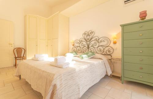 Ένα ή περισσότερα κρεβάτια σε δωμάτιο στο Casa Bellavista