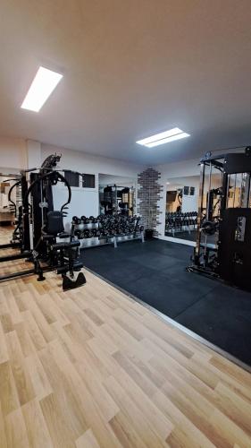 a room with a gym with treadmills and machines at Confort Suites in Reggio Calabria
