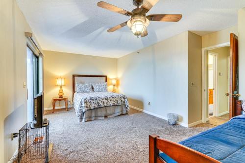 a bedroom with a bed and a ceiling fan at Panama City Waterfront Escape Fenced Yard and Dock! in Panama City