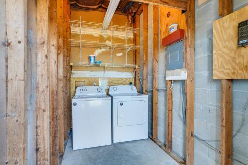 a laundry room with a washer and dryer at Panama City Waterfront Escape Fenced Yard and Dock! in Panama City