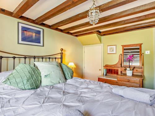 a bedroom with a bed and a wooden ceiling at 2 Bed in Portland 91468 in Castletown