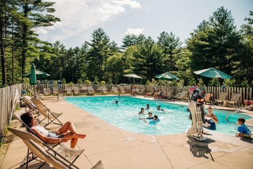 a group of people in a swimming pool at Huttopia Southern Maine in Sanford