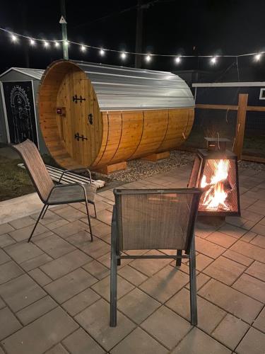 a wooden boat sitting next to a fire pit at The Flat Spot in Princeton