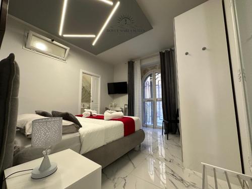 Postel nebo postele na pokoji v ubytování Dolce Marea Suites