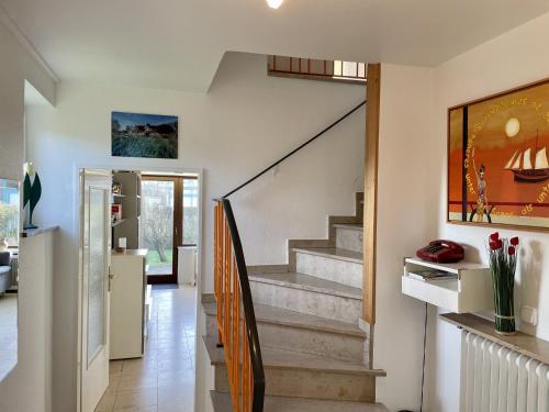 a hallway with stairs in a house at Sonneneck in Westerland (Sylt)