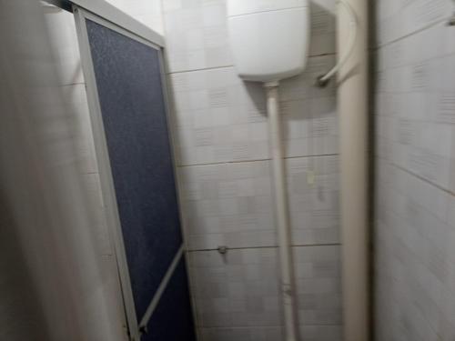 a bathroom with a toilet and a shower stall at CASA CARNAVAL OLINDA- 700M PREFEITURA in Olinda