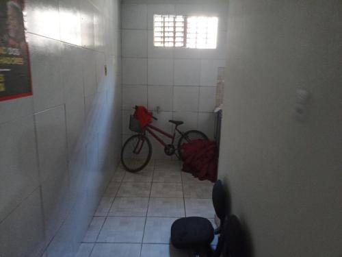 a bike parked in a room with a hallway at CASA CARNAVAL OLINDA- 700M PREFEITURA in Olinda