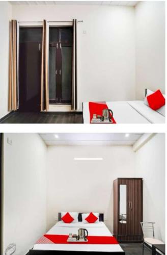 um quarto branco com uma cama com almofadas vermelhas em Hotel Heaven residency em Greater Noida