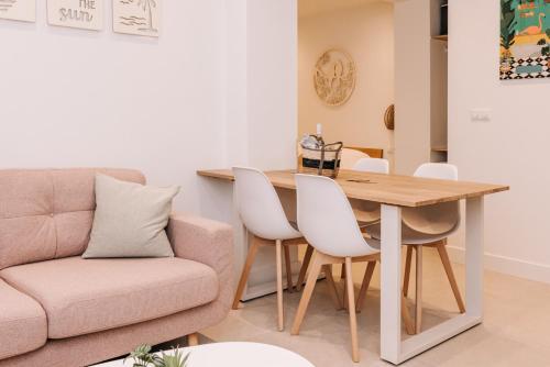 a living room with a table and a couch at Simply studio's in Zandvoort