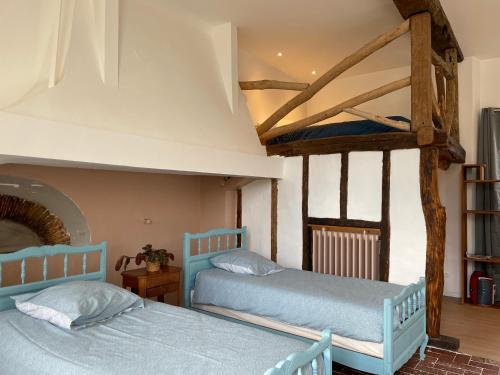 Un ou plusieurs lits dans un hébergement de l'établissement Domaine de Bontemps