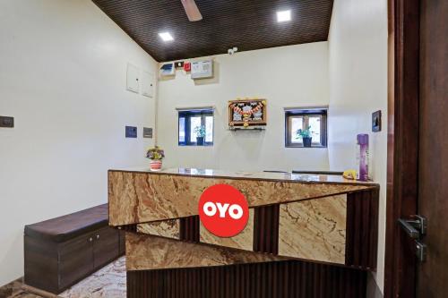 a lobby with aiya sign on a counter at Malali Residency in Mumbai