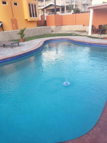 a swimming pool with a toy in the water at Noud Villa in Santa Cruz