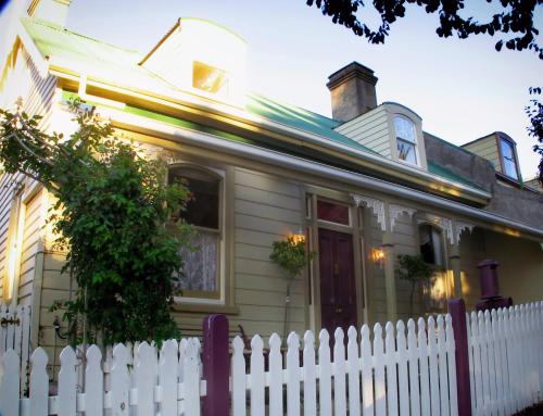 a white picket fence in front of a house at Ellie's Place on City Park in Launceston