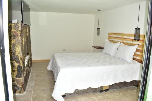 Postel nebo postele na pokoji v ubytování Apartaestudio Loft 102 - UE Home