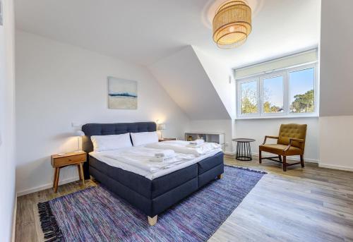 Giường trong phòng chung tại Ferienhaus "Süsterhüs" - Seeluft und Komfort