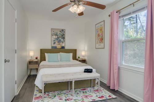 a bedroom with a bed and a ceiling fan at 15mins AU & Golf: 4bd - Eclectic - BBQ Grill in Augusta