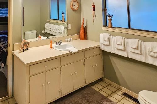 a bathroom with a sink and a mirror at Heart's Desire on the Lake (01-275) in Groveland