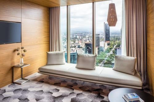 a room with a window seat with a view at Sofitel Mexico City Reforma in Mexico City