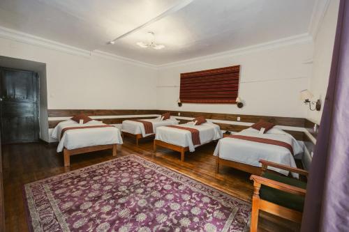 Una cama o camas en una habitación de La Casona Real Cusco