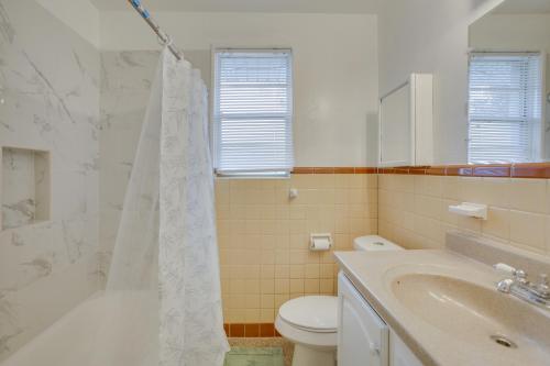 a bathroom with a sink and a toilet and a shower at New Orleans Area Home about 5 Mi to City Park! in Metairie