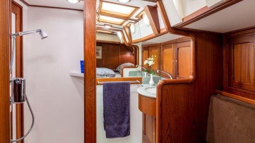 a bathroom with a sink and a shower at Sail Events Friesland in Woudsend