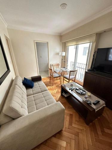 a living room with a couch and a table at Pleno Recoleta in Buenos Aires