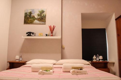 a bedroom with a bed with two towels on it at Il Castello di Atessa in Atessa