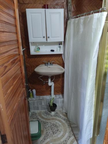 a bathroom with a sink and a shower at La Loma Camping in Higuey