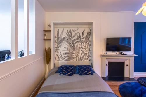 En eller flere senge i et værelse på L Amiens Haussmann-Gare-Centre-ville Hortillonnages-WIFI