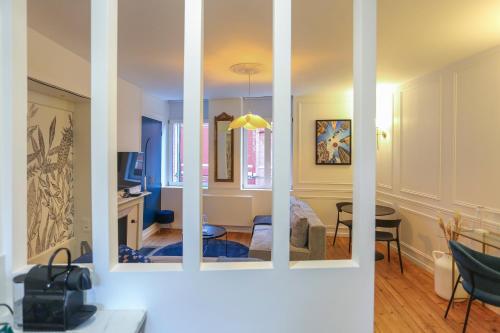 a view of a living room and a dining room at L Amiens Haussmann-Gare-Hortillonnages-Centre-ville-WIFI in Amiens