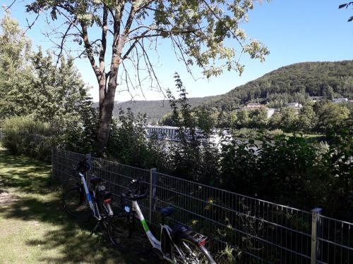two bikes are parked next to a fence at Holiday Home Tiny Haus Altmühlblick II by Interhome in Riedenburg