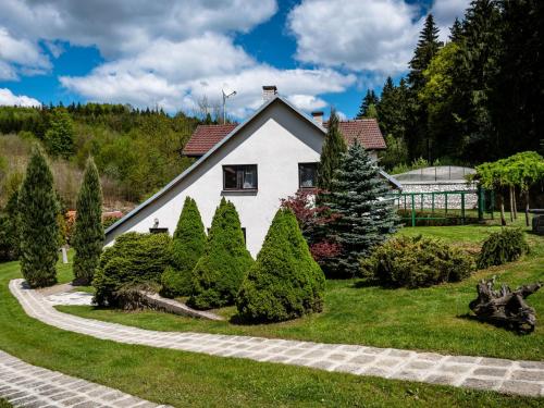 a house with a garden in front of it at Holiday Home Malovidy by Interhome in Rataje nad Sázavou