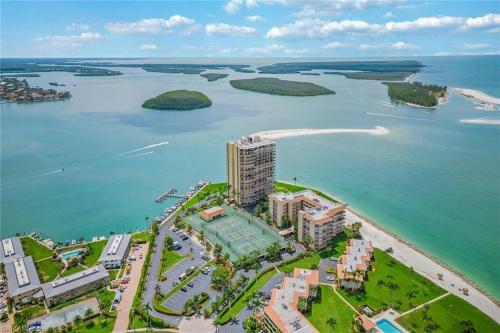 an aerial view of a beach and the ocean at Breath-taking waterfront condo with pool/spa/tennis in Marco Island