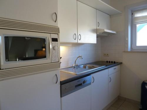 Køkken eller tekøkken på Apartment Green Garden 23 - 204 with shared pool by Interhome