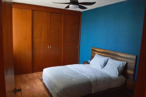 Ένα ή περισσότερα κρεβάτια σε δωμάτιο στο Preciosa y Cómoda Casa en Coto Tlaquepaque Centro.