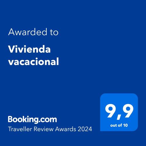 a blue text box with the words awarded to vivananda vazquezinosaur at Vivienda vacacional in Puerto del Rosario
