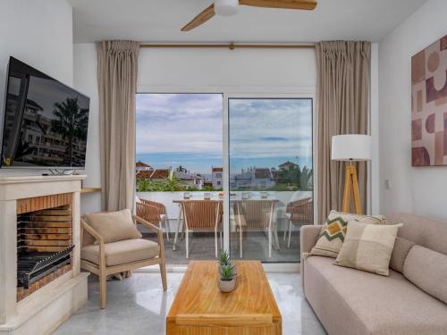 TV a/nebo společenská místnost v ubytování Apartment Ático Los Pelicanos by Interhome