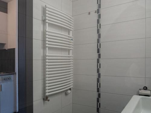 a bathroom with a shower with a window at Apartment Valaisia 24A by Interhome in Nendaz