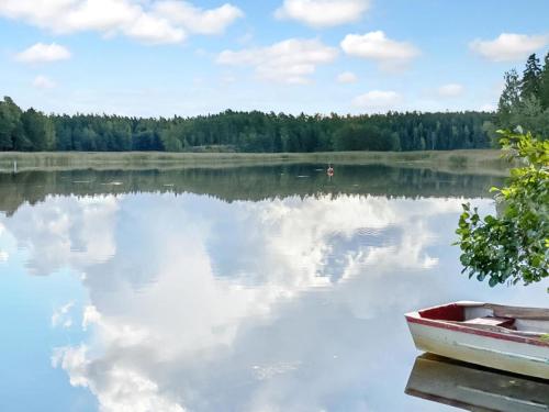 a view of a lake with a boat on it at Holiday Home Köningsviken by Interhome in Sipoo