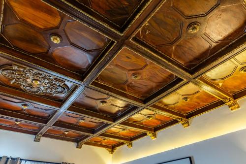a coffered ceiling in a room with wood at Casa Castillo in Mexico City